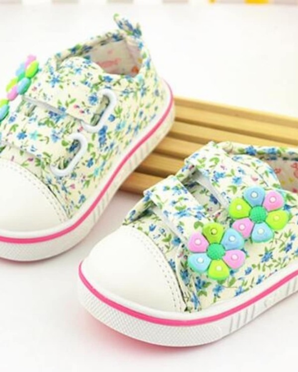 Kids shoes in white with blue and green floral print, stylish for parties