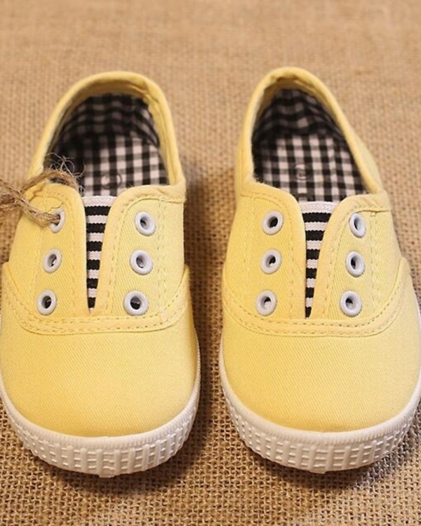 Yellow boys shoes with black checks, stylish and festive for weddings