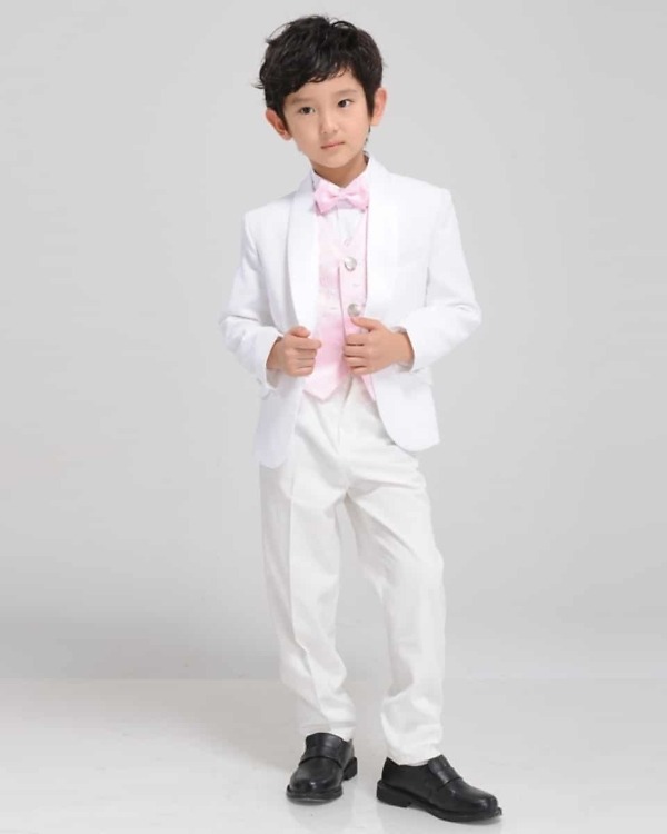 White tuxedo with pink vest for boys, stylish and cute for weddings or gifting