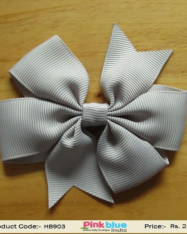 Grey double knot bow hair accessory for baby party outfit, modern stylish look