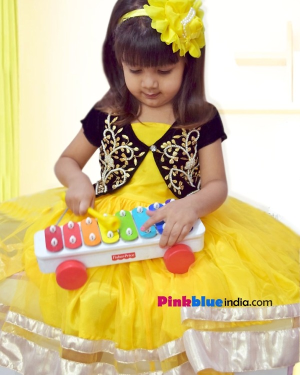 Bright yellow girls dress for festive party wear, vibrant stylish outfit