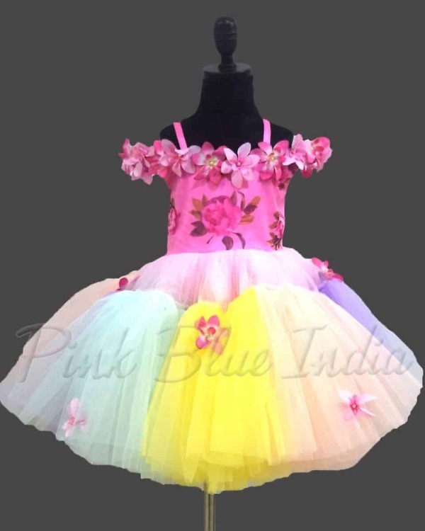 Designer floral gown for baby girl in soft tones, elegant birthday celebration wear