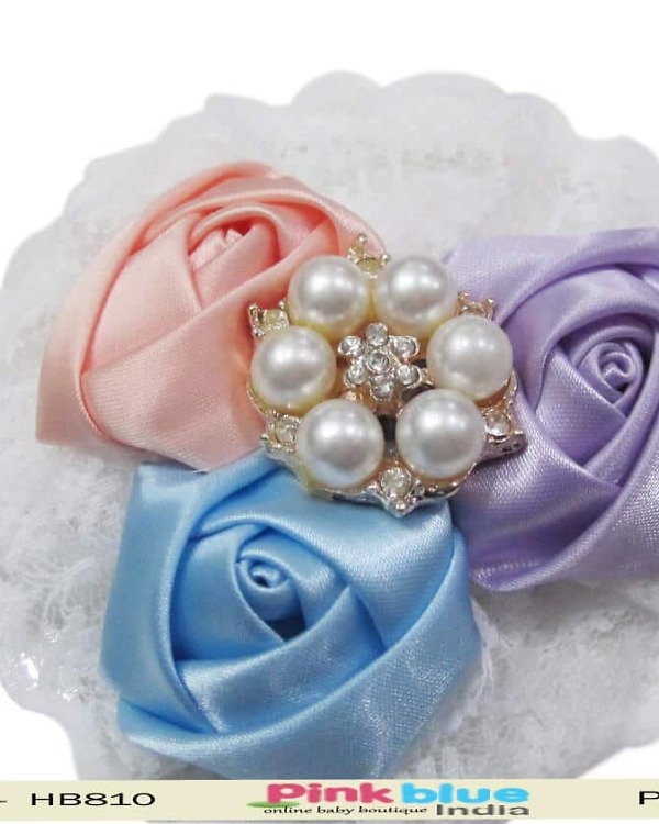 White infant girl headband for wedding occasion, pure and elegant look