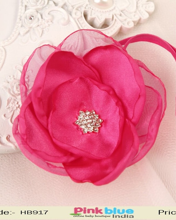 Magenta pink flower hair accessory for kids festive wear, bright stylish look