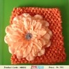 Orange crochet flower headband for kids festive outfit, bright cheerful style