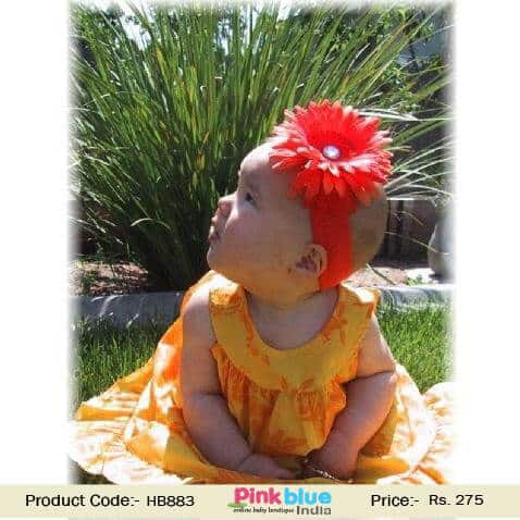 Red flower hair accessory for baby girl festive outfit, bold stylish look