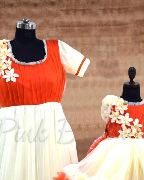 Orange flower matching dresses for mom and daughter family festive party wear