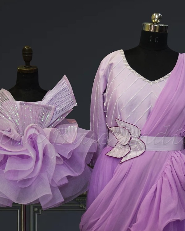 Stylish mother-daughter matching gowns, pink-blue festive wear